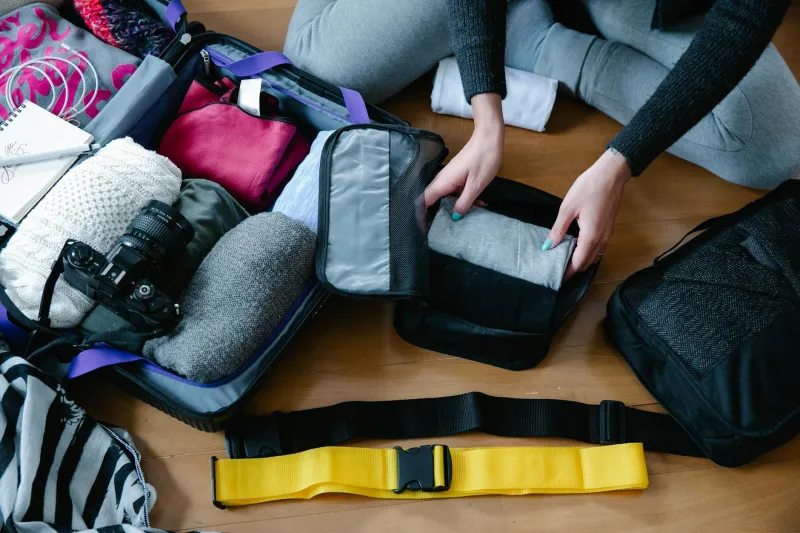 The Delusional Optimist's Guide to Packing Like You're Someone Else Entirely